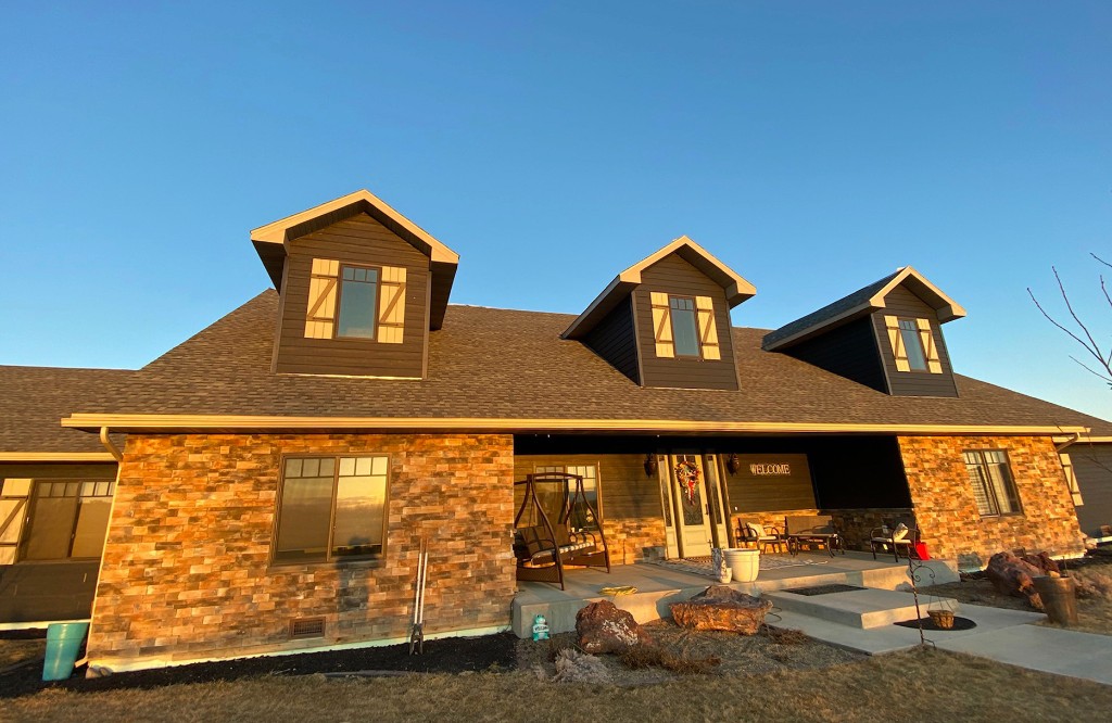 Exterior siding inspection on a Billings, MT property