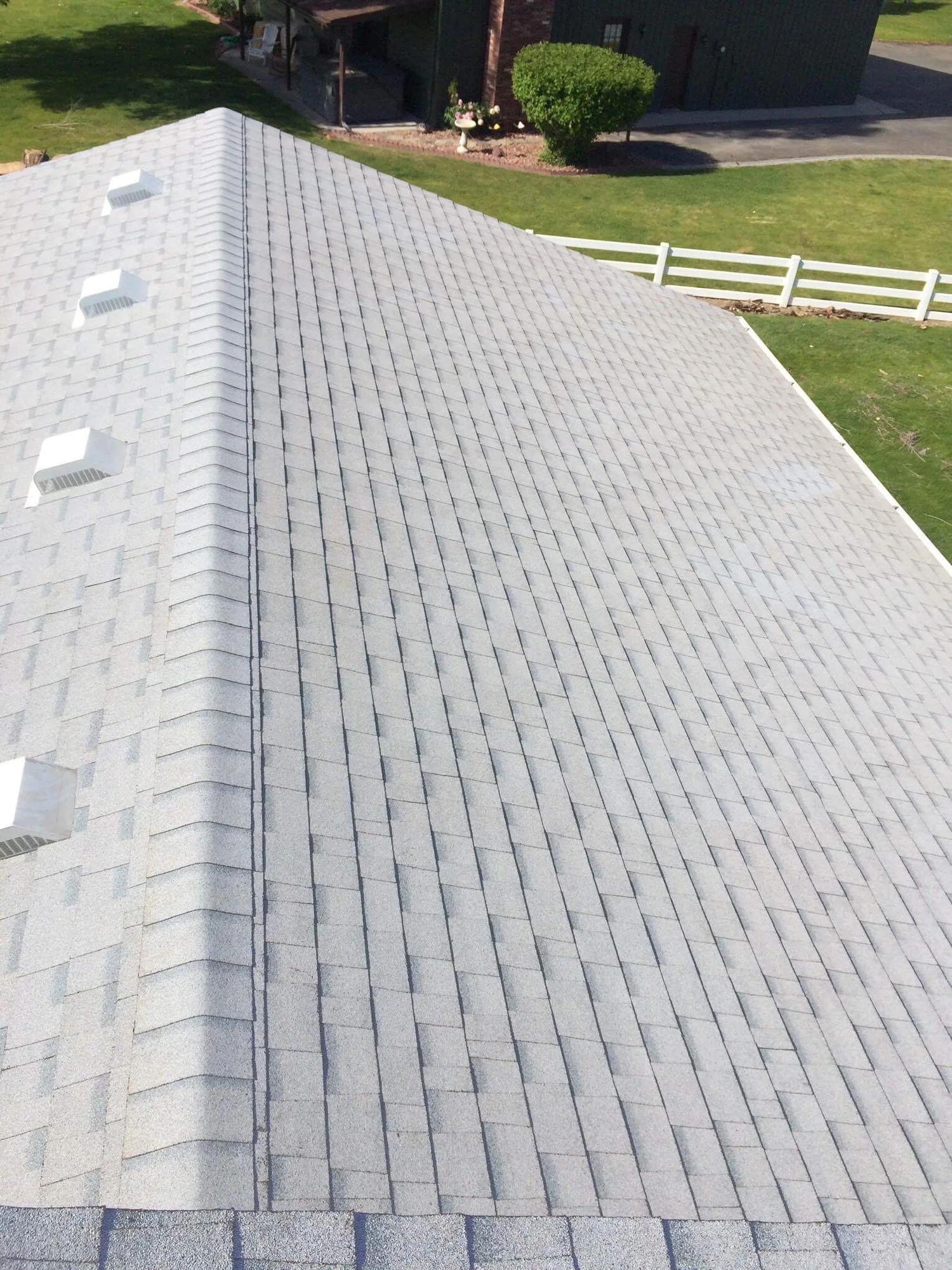 Two-story home with new gutters installed in Valrico, Florida
