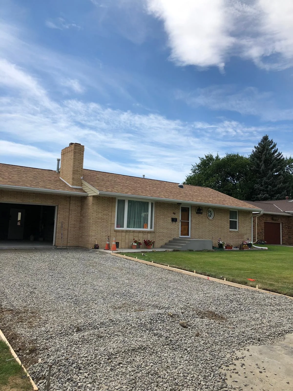 Corner downspout and drainage detail on a Plant City gutter installation